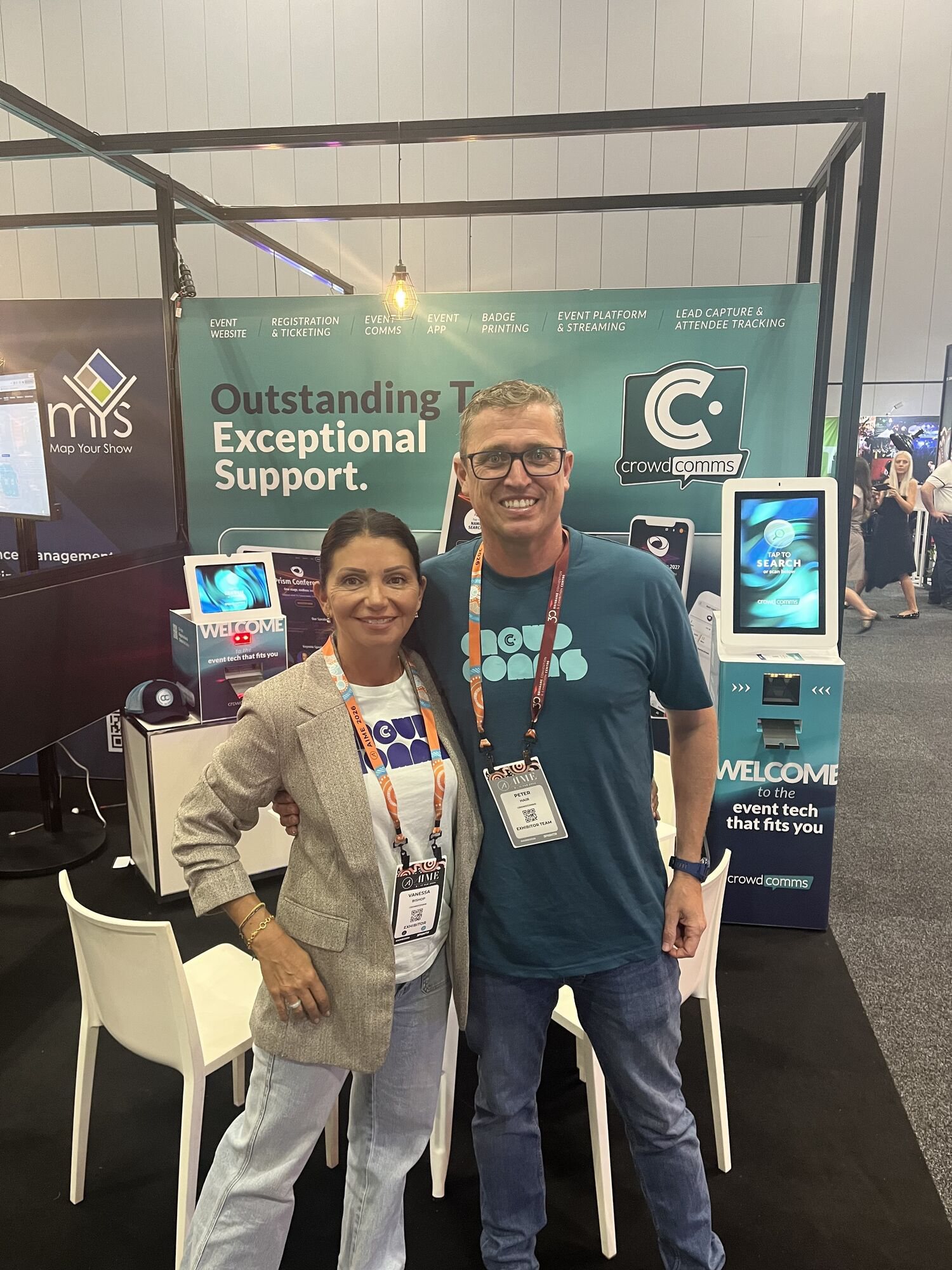 Vanessa and Pete from the CrowdComms Australia team on the stand at AIME